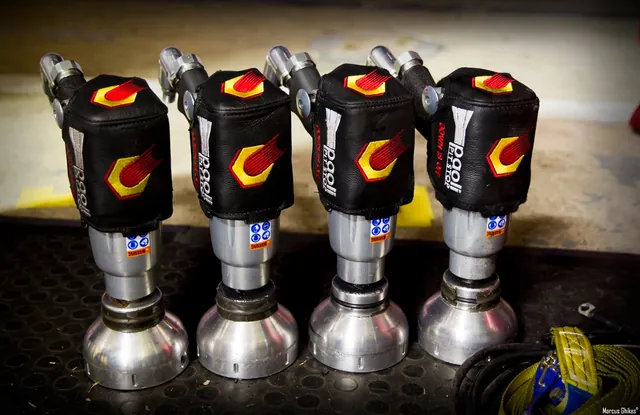 Four Paoli pit-stop wheel guns lined up on a workbench
